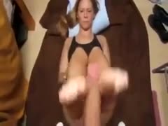 My lustful, sultry wife gives me a footjob and then licks her toes.
